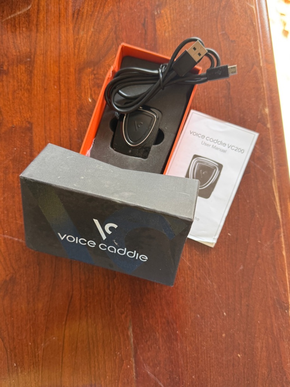 Voice Caddie VC200 Golf GPS Voice Unit - Black with Orange Box